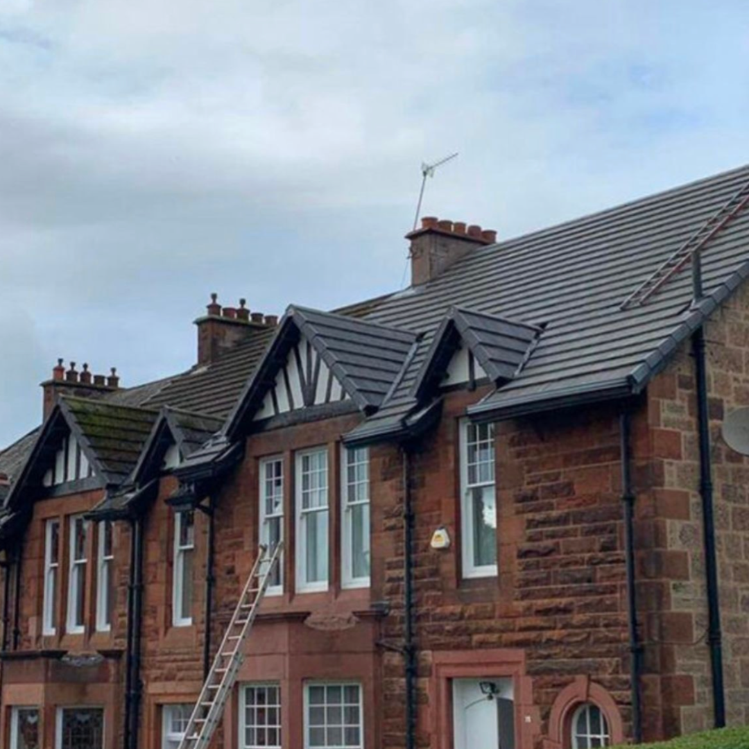 Large slate-style roof replacement on a period property