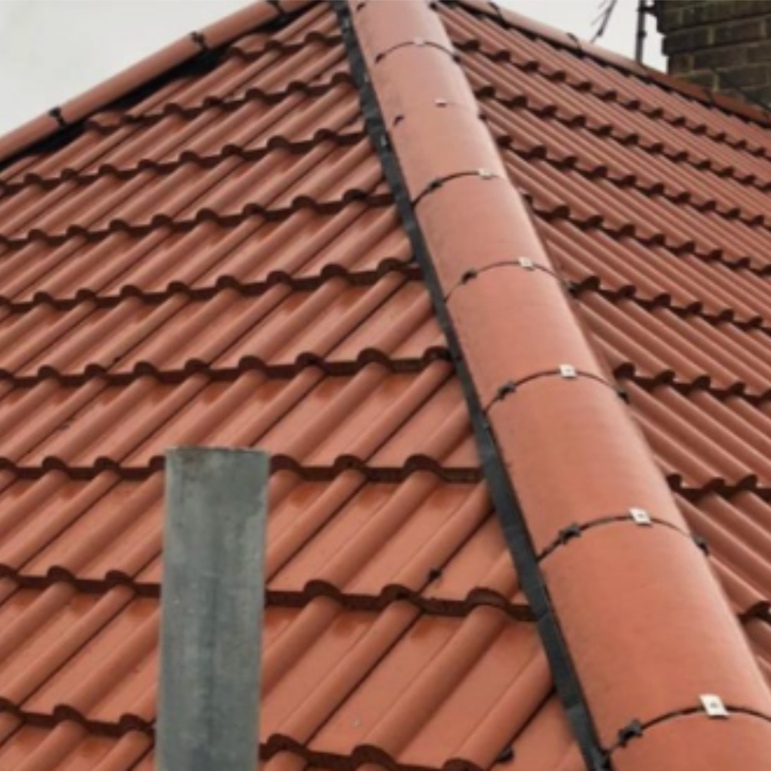 Close-up of a newly installed tiled roof and ridge detail
